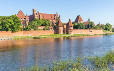 Naklejka na ściany i meble Malbork, Poland - largest castle in the world by land area, and a Unesco World Heritage Site, the Malbork Castle is a wonderful exemple of Teutonic fortress