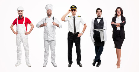 Group of workers in uniforms standing in studio