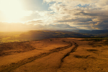Golden sunset over fields after a heavy storm in the Peak District