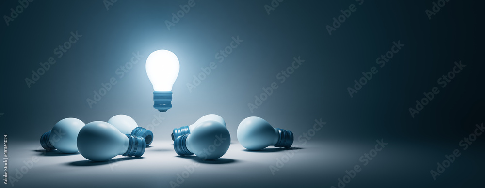 Poster creative illuminated lamps on wide gray background with mock up place. idea, teamwork and leadership