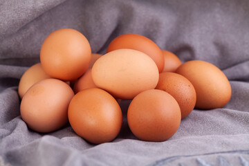 chicken eggs put on fabric gray