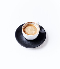 Cup of coffee on bright wooden background. Copy space.