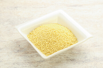 Raw couscous in the bowl