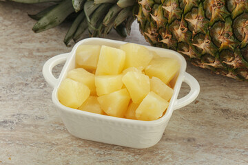 Marinated pineapple slices in the bowl