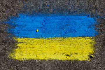 Flag of Ukraine. Chalk drawing on sidewalk. Creative support by children for Ukraine