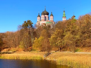 Obraz premium Kyiv Ukraine orthodox church in the autumn park Theophania. Majestic St. Panteleimon Monastery.