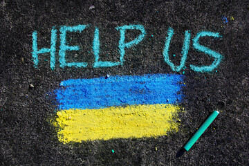 Flag of Ukraine and text HELP US. Chalk drawing on sidewalk. Support for Ukraine. War problem and requests for support
