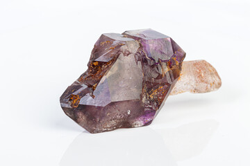 macro mineral stone Amethyst on smoky quartz on a white background