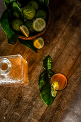 rum in a glass shot and bottle on dark wooden background, wealthy luxury bar atmosphere