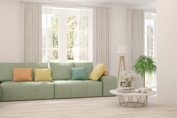 White living room with sofa and summer landscape in window. Scandinavian interior design. 3D illustration