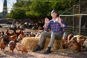 man holding duck egg at poultry farm