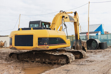 Heavy excavators at a construction site. Construction equipment for earthworks. Quarry excavator. Improvement of the territory and earthworks.