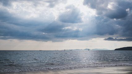 Naklejka na ściany i meble Landscape image of tropical white beach with blue sea and sky background