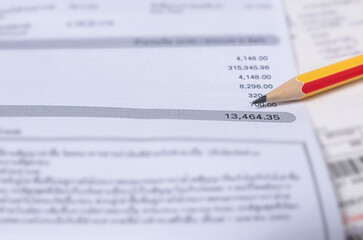 Obraz premium Utility energy bill with pencil blurred background