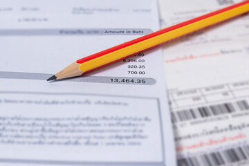 Obraz premium Utility energy bill with pencil blurred background