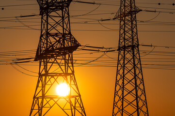 High voltage cables at sunset. 