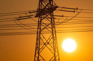 High voltage cables at sunset. 