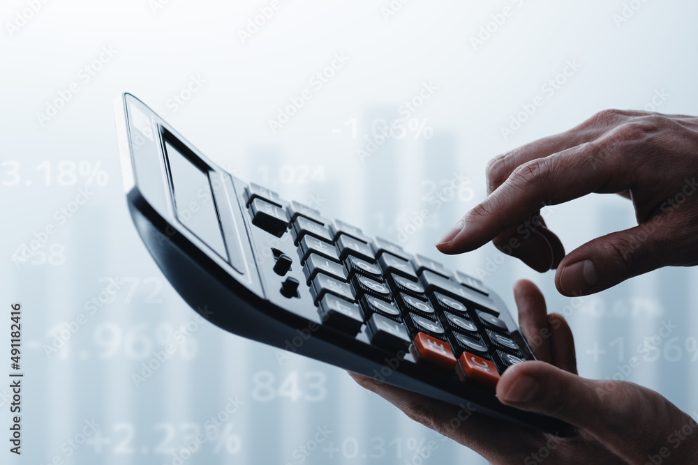Poster Calculating costs and benefits. Working with calculator. Graph and number. Close up of hands.
