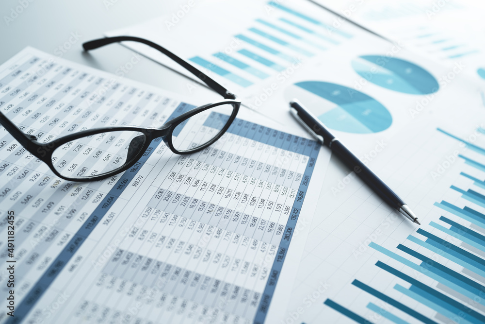 Aufkleber many reports with graphs and figures. glasses and pen. financial analysis and management concept.