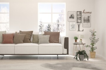 White living room with sofa and winter landscape in window. Scandinavian interior design. 3D illustration