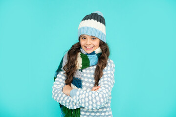 portrait of child wearing warm clothes. express positive emotion. winter fashion