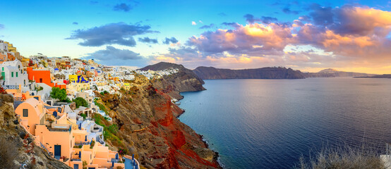 Picturesque sunset on famous view resort over Oia town on Santorini island, Greece, Europe. famous...