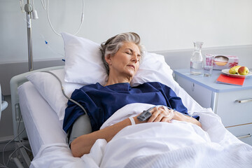 Hospitalized senior woman sleeping at hospital