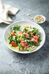 Traditional Caesar salad with salmon