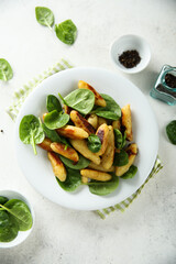 Potato dumplings with fresh spinach