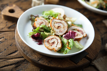 Homemade chicken roulade with salad