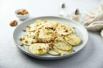 Courgette carpaccio with walnut and olive oil