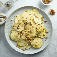 Courgette carpaccio with walnut and olive oil