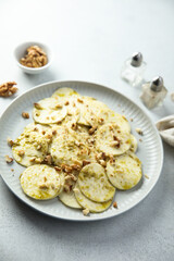 Courgette carpaccio with walnut and olive oil