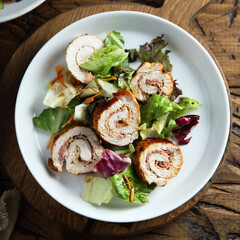 Homemade chicken roulade with salad