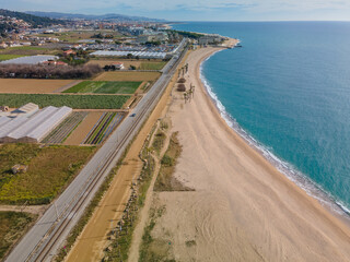 Fototapeta na wymiar Aerial images of the beach of Malgrat de Mar in the Maresme Costa Brava pine forest without people drone