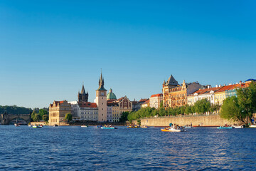 Fototapeta premium Vltava river side with Bedrich Smetana Museum, Old Town Bridge Tower and Charles bridge. Prague, Czech Republic