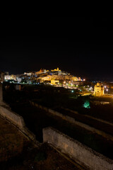Fototapeta na wymiar Panoramic wide view of Ostuni by night, the white city in Apulia, southern Italy