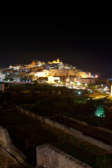 Panoramic wide view of Ostuni by night, the white city in Apulia, southern Italy