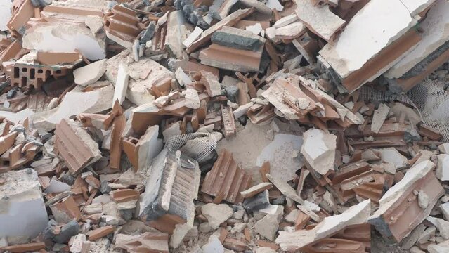 Pile of construction waste after wall demolition in an apartment during remodeling