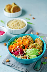 Quinoa Beet Hummus Falafel Bowl in a bowl