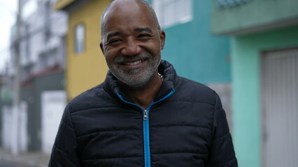 Obraz premium A Happy Brazilian black man laughing and smiling portrait face in urban street