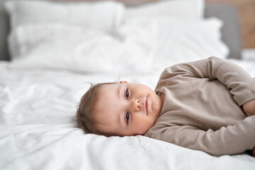 Obraz na płótnie Canvas Caucasian little baby girl sleeping on bed at home