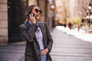 Fototapeta premium Happy girl, having a funny conversation over the phone.