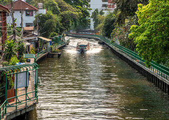 Water taxi in a canal in downtown Bangkok