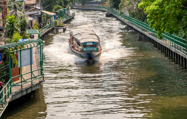 Water taxi in a canal in downtown Bangkok