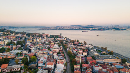 Obraz premium Aerial view of the Bosphorus Strait from the side of Blue Mosque. Top view of the beautiful cityscape of Istanbul, parts of Asian Turkey (Anatolia) from European Turkey on sunset