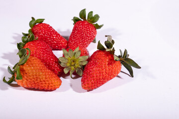 Red strawberries photography with white background.