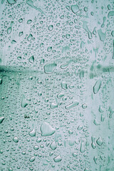 raindrops on the grey metal surface