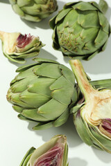 Concept of healthy food with artichoke on white background