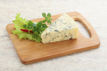 Blue cheese piece over board
